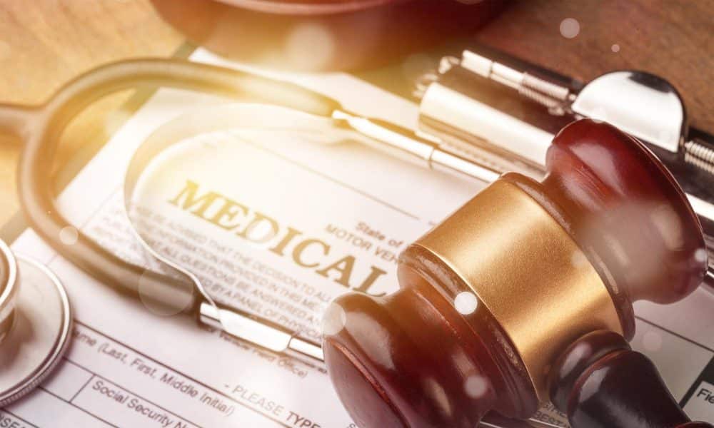 Gavel and stethoscope resting on a medical form, representing LeFante Law's personal injury and medical case experience
