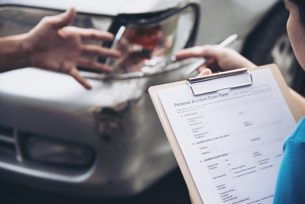 Attorney reviewing trip records and police reports in a rideshare accident claim