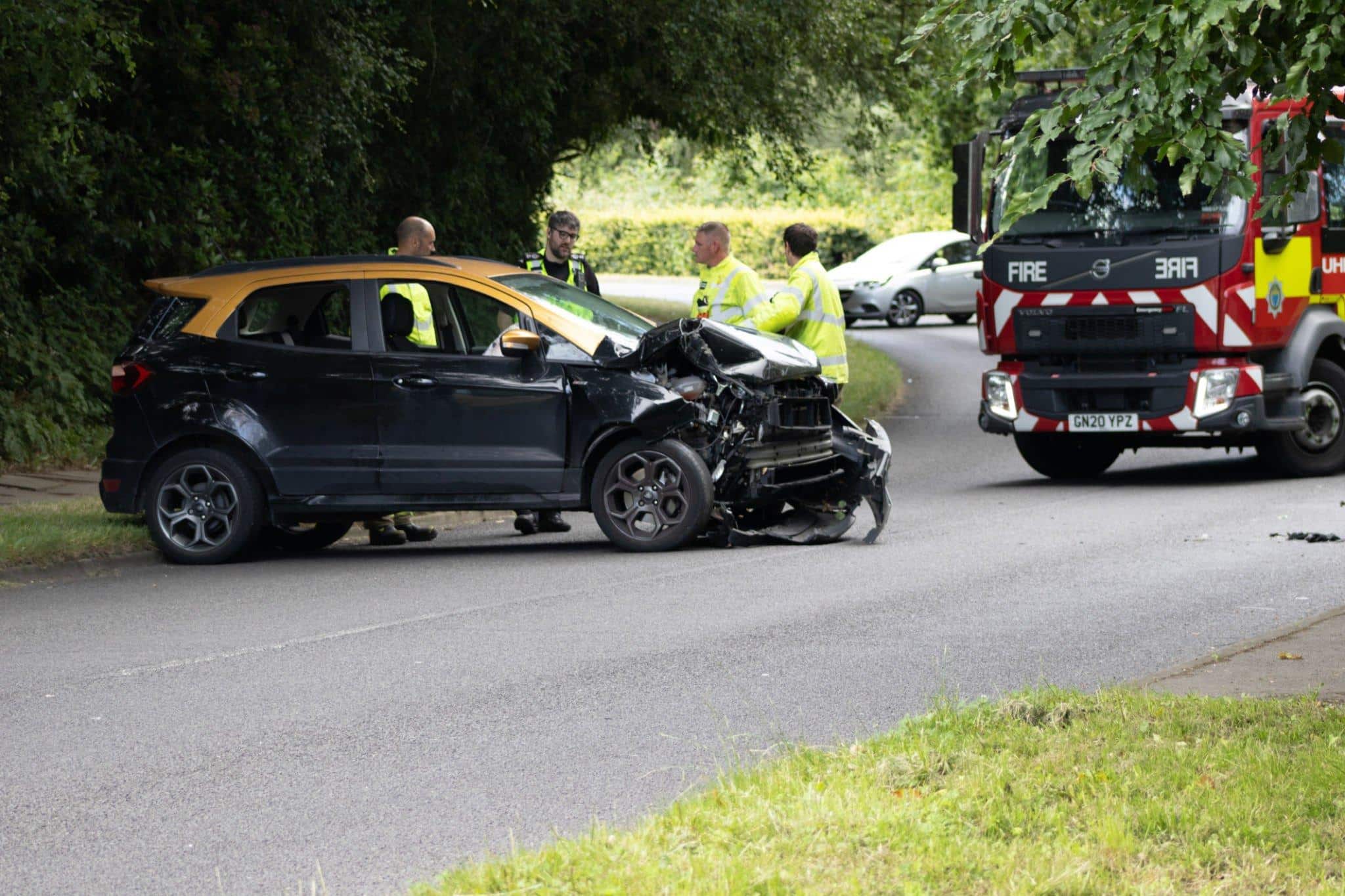 Injured pedestrian receiving help after being hit by a car